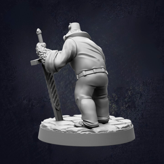 A white figurine of a person holding a sword and standing on a rock.