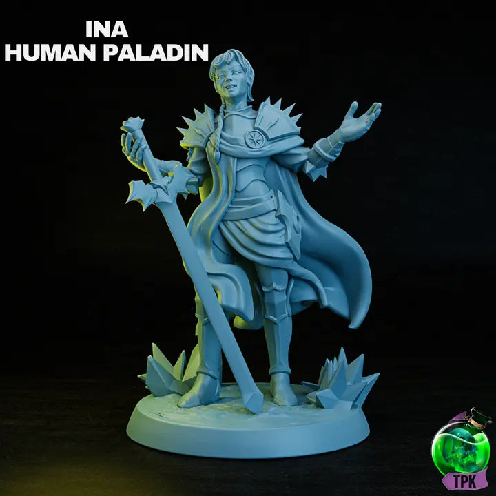 A labelled image of a rendered 3D-printed fantasy miniature of a confident female paladin in ornate armor, holding a large sword with an outstretched hand. Cloak flowing, posed on a textured base.