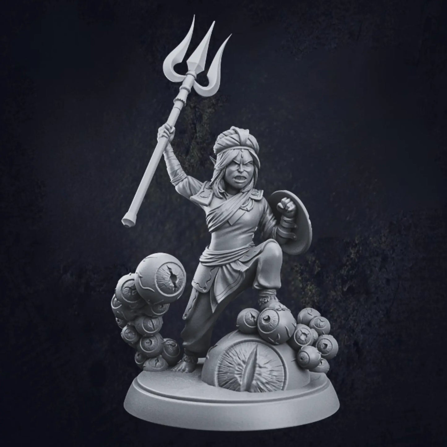 A highly detailed 3D-printed miniature figurine, designed by TPK Labs, featuring a warrior with an intricate, ornate style. The warrior is clad in a flowing robe and turban-like headgear, wielding a trident in the right hand and a shield in the left. The base of the figurine is circular and strikingly unique, decorated with multiple sculpted eyeballs, adding an eerie and fantastical aesthetic. The miniature is crafted from resin showcasing fine craftsmanship.
