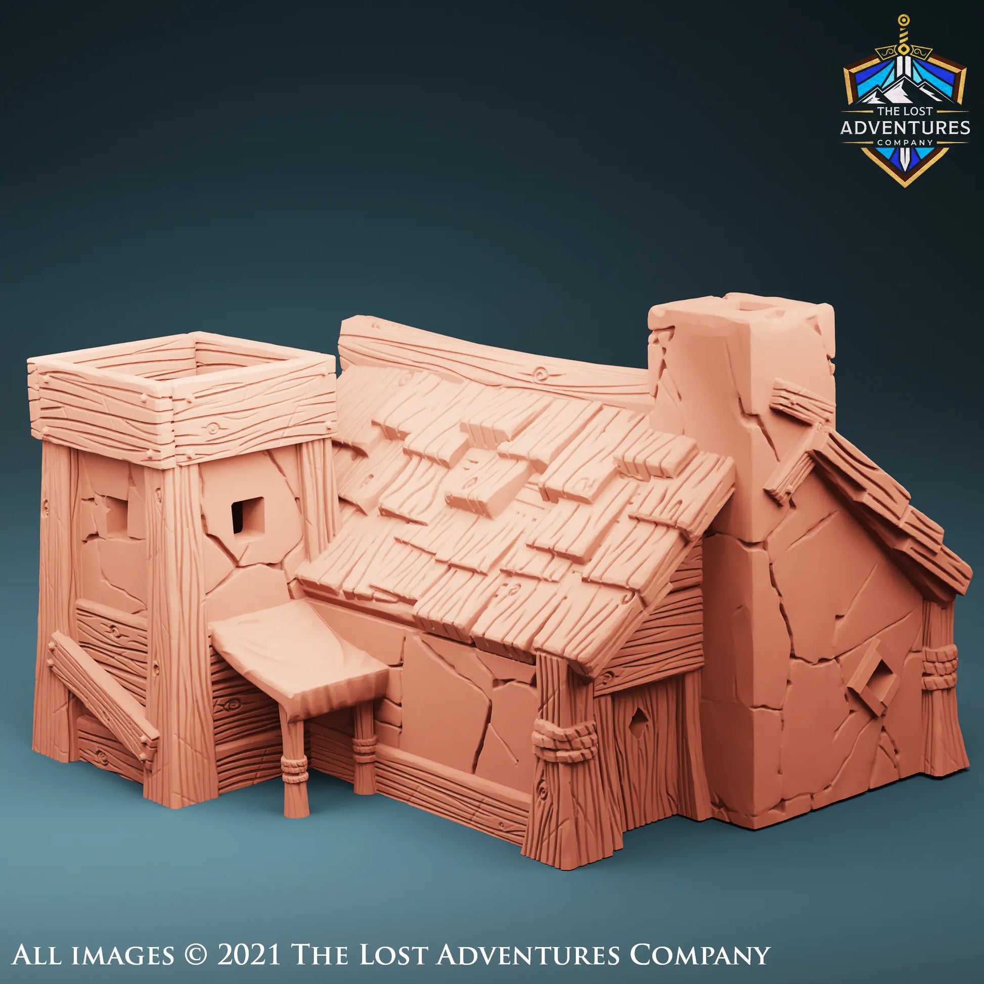 A detailed 3D model of a medieval-style tower house designed for tabletop RPGs. The tower features stone-textured walls with wooden beams, a steeply slanted roof adorned with shingles, and a small chimney. The structure has a square opening at the top, showcasing its playable interior for role-playing game scenarios. The model by The Lost Adventures Company is intricately crafted for fantasy gaming environments.