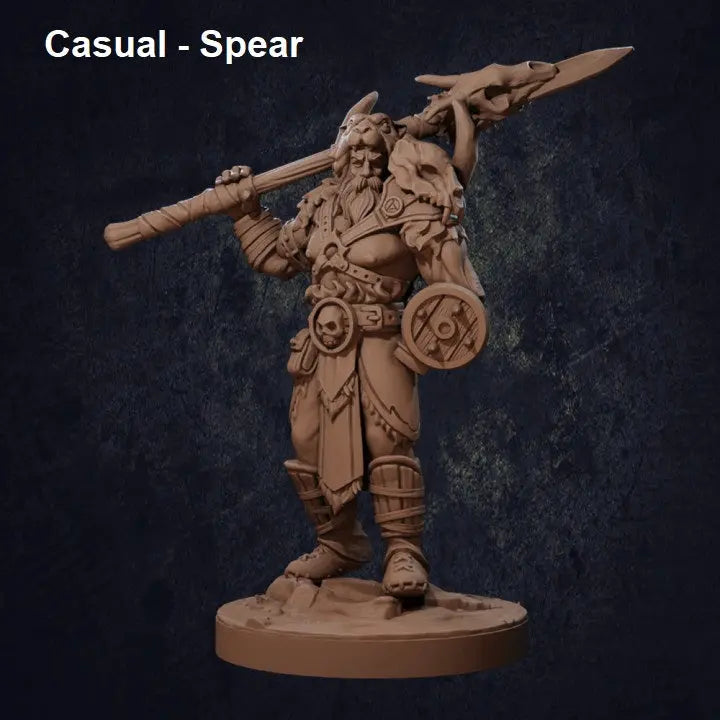 A finely sculpted DnD miniature of a Viking-style barbarian warrior standing in a poised yet powerful stance, gripping a long spear in a relaxed hold. The warrior has a muscular build, long hair, and a calm yet battle-ready demeanor. His rugged armor features fur accents, a chest harness, and bracers. The miniature is set on a textured base resembling rocky terrain.