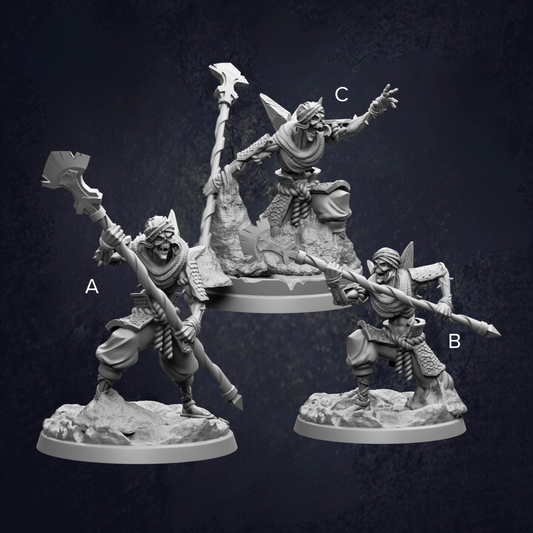 three figurines of characters, each with unique poses and weapons, set against a dark background.