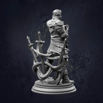 A statue of a person holding a sword and shield, standing on a pedestal.