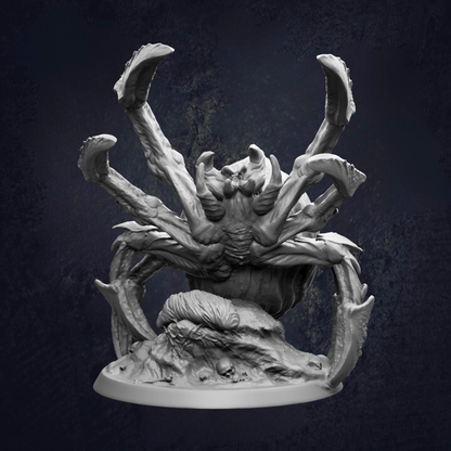 A detailed, intricate sculpture of a large, menacing-looking spider with multiple legs and sharp fangs, set against a dark background.