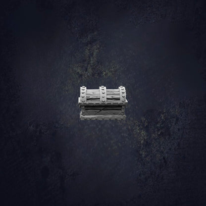 A white, rectangular object with a curved top and bottom sits in the center of a dark, textured background.