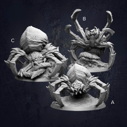 three detailed sculptures of large, intricate, and fantastical creatures, including a spider-like creature with multiple legs and a round body.