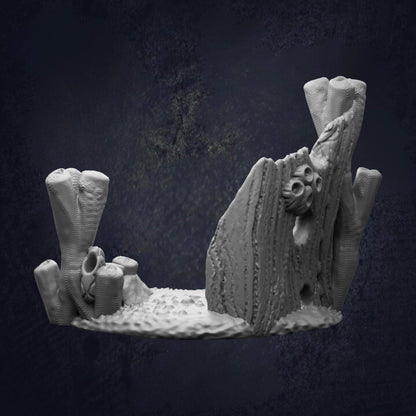 A 3D rendering of a rocky formation with various textures and shapes, including a large rock formation with a carved face and other organic elements.