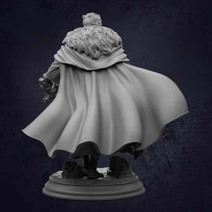 A statue of a person wearing a cape and holding a shield, standing against a dark background.