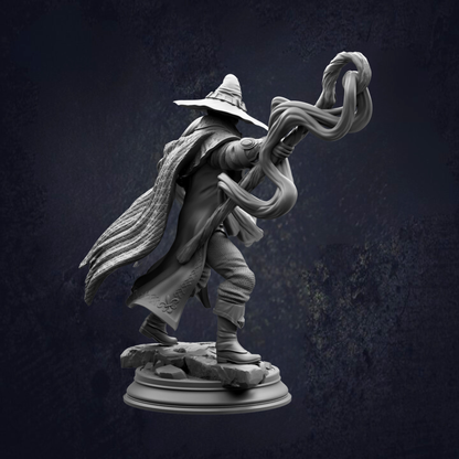 A detailed 3D rendering of a wizard or magical figure, holding a staff and wearing a pointed hat, standing on a platform against a dark background.