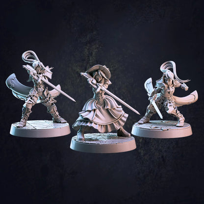 An unpainted 32mm scale set of three female vampire hunter miniatures, each posed dynamically and standing on 30mm bases. The first model wears a Victorian-style dress and wields a sword with both hands in a battle-ready stance. The second model is clad in armor, brandishing a sword confidently. The third model, also in armor, holds a sword in one hand while posed in a dodging maneuver, evading an attack. Each figure features intricate detailing, emphasizing their warrior prowess.
