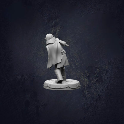 A white figurine of a person in a cape and hat is shown against a dark background.