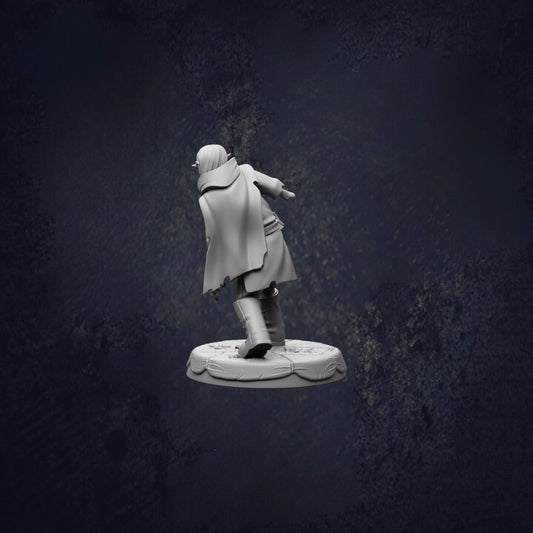A white figurine of a person in a cape and hat is shown against a dark background.