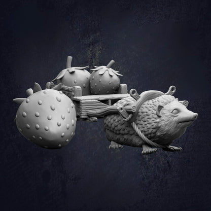 A whimsical sculpture of a hedgehog carrying three strawberries on a wooden cart.