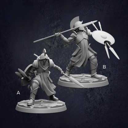 two figurines of soldiers, each holding different weapons such as spears and shields.