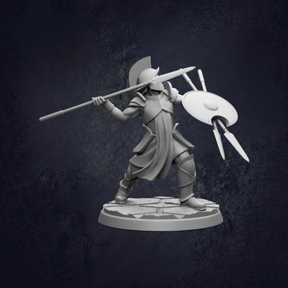 A 3D model of a warrior figure holding a spear and shield, standing on a platform against a dark background.