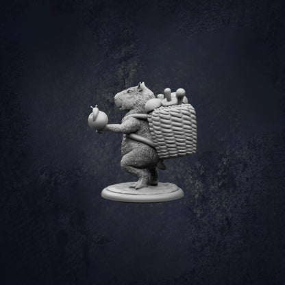 A statue of a rat carrying a basket of apples.