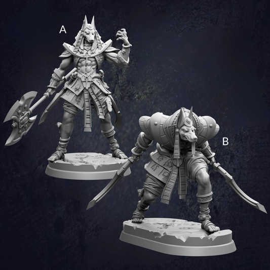 two figurines of Egyptian-style characters, one standing upright and the other crouching, both holding weapons.