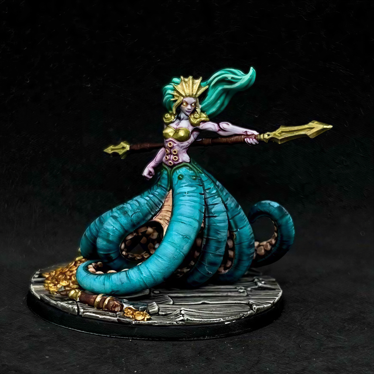 A detailed and colorful figurine of a mermaid-like character with a long, flowing tail and a crown-like headdress, holding a spear and standing on a platform.