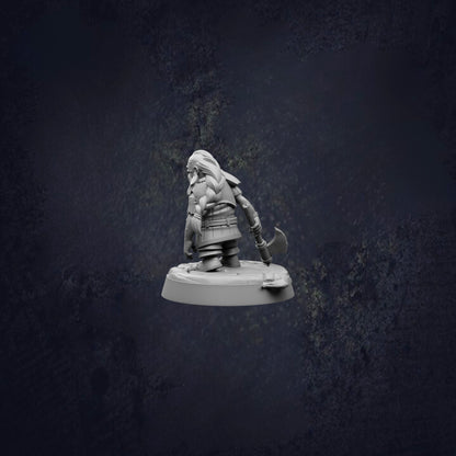 A small, detailed figurine of a dwarf or gnome-like character, possibly from a fantasy or adventure game, is shown against a dark background.