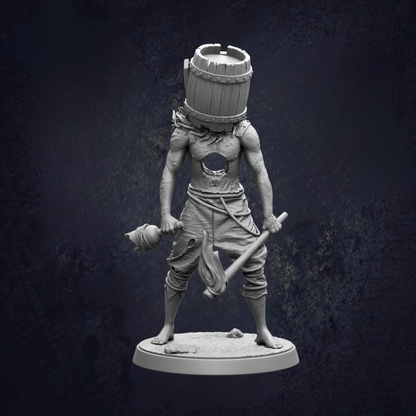 A statue of a person with a barrel on their head, holding a weapon and standing on a base.