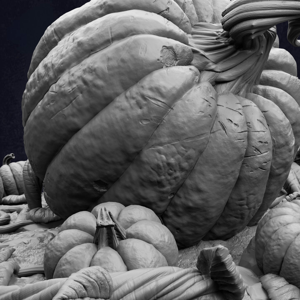 A large, intricately carved pumpkin sculpture dominates the image, surrounded by smaller pumpkins.
