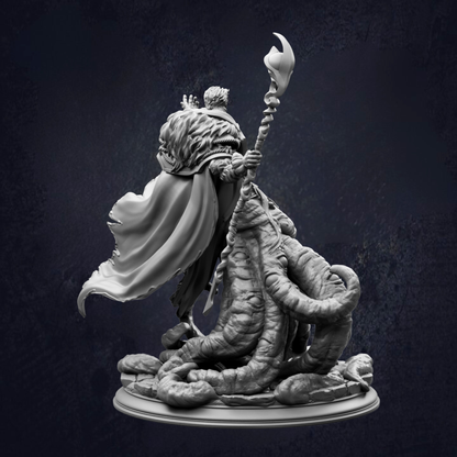A detailed 3D model of a fantastical creature, possibly a dragon or serpent, with a flowing cape and a staff or staff-like object. The creature is depicted in a dynamic pose, with its head turned to the side and its body coiled or twisted. The background is dark and textured, providing a stark contrast to the intricate details of the sculpture.