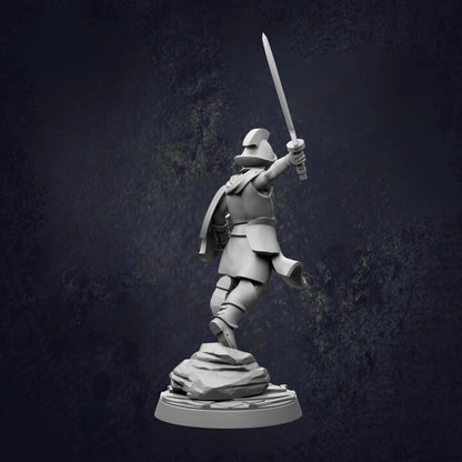 A 3D model of a warrior figure holding a sword and standing on a rock formation against a dark background.