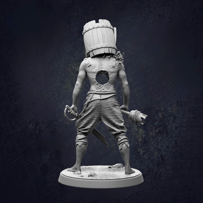 A statue of a pirate standing with a barrel on his head, holding a sword and a mace.