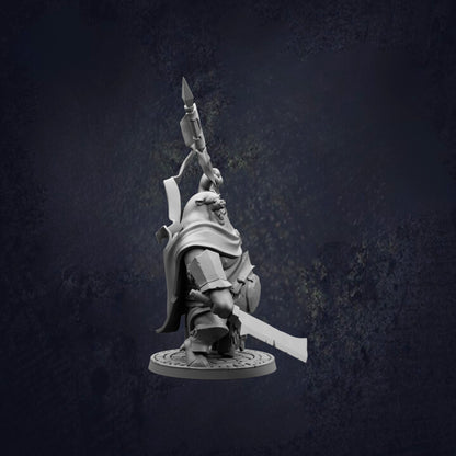 A 3D model of a character holding a spear and shield, standing on a platform against a dark background.