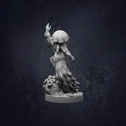 A statue of a jellyfish with a long, flowing body and a large, round head, standing on a rock and waving its tentacles.
