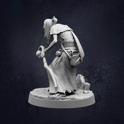 A black and white image depicting a statue of a person with long hair and a flowing robe, holding a staff and standing on a stone pedestal.