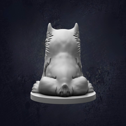 A white, sculpted statue of a cat or feline figure is shown against a dark background.