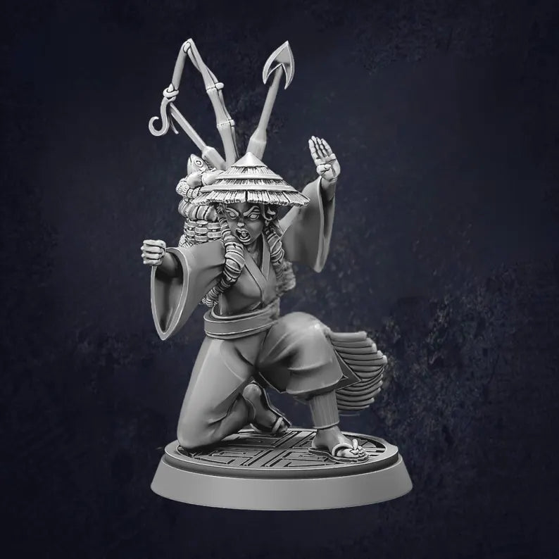 Female monk carrying fishing gear on her back while kneeling down on one knee with a fist out front. 