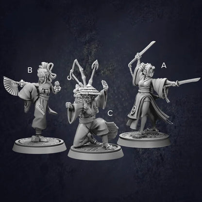 Set of three female monk fighters displaying different stances and weapons in traditional Japanese clothing.