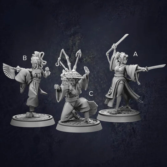 Set of three female monk fighters displaying different stances and weapons in traditional Japanese clothing.