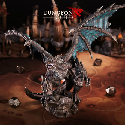 A photo of a painted 32mm scale dragon miniature, towering at 205mm in height. The dragon is posed majestically atop a jagged rock, with its massive wings spread wide. One claw grips the front of the rock, showcasing its dominance and power. The sculpt features intricate details, including sharp scales, curved horns, and a fierce expression, emphasizing the creature’s imposing presence. Ideal for any tabletop gaming session and an imposing boss.