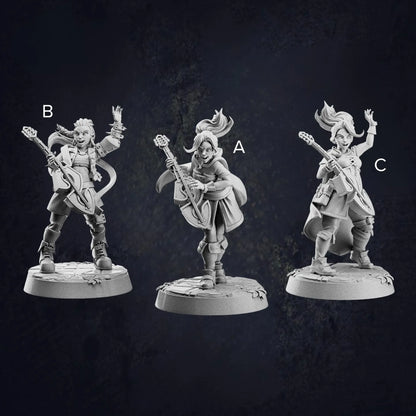 A labelled image of three unpainted miniature figurines of fantasy female human bards, each holding a lute and posed dynamically. They wear detailed adventurer-style clothing with capes, boots, and various accessories. Each bard has a unique stance, with expressive faces and lively hair sculpted to suggest movement. The miniatures stand on round bases with engraved textures, against a dark, textured background.