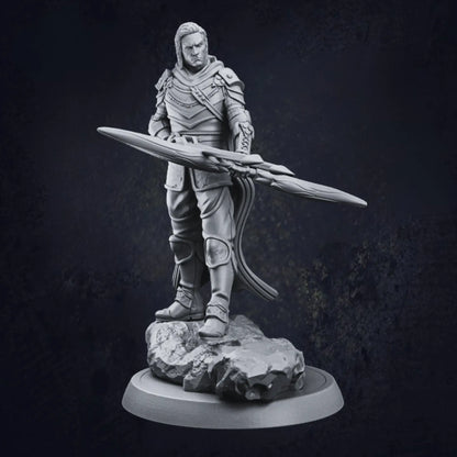A highly detailed model of a male elven ranger, standing confidently on a rocky base. The ranger wears ornate armor adorned with intricate patterns and textures, including shoulder pads, arm guards, and knee pads. He holds a large, elaborately designed bow horizontally across his body, emphasizing his prowess as a skilled archer. High Quality and crafted from resin.
