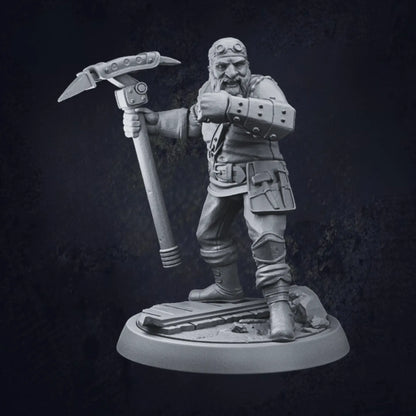 A 3D-printed model of a Dwarven Artificer, standing on a circular base with one foot raised on a platform. The figure wields a large hammer in one hand and features a mechanical arm with visible rivets and joints. Wearing a detailed outfit adorned with pouches, knee pads, and a tool belt, the artificer's robust design highlights intricate craftsmanship and industrial flair. 