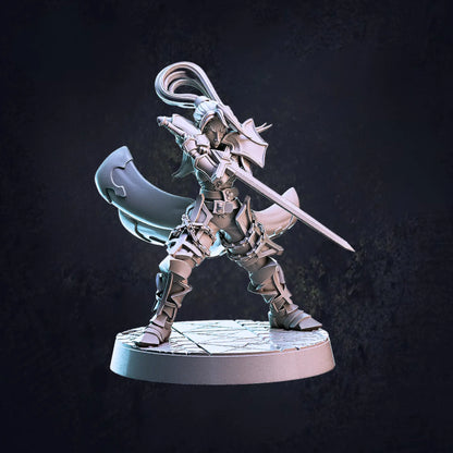 Model B - An unpainted 32mm scale female vampire hunter miniatures, each posed dynamically and standing on 30mm base. The  model is clad in armour, brandishing a sword confidently. The figure features intricate detailing, emphasizing their warrior prowess.