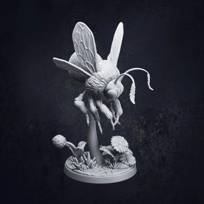 A highly detailed 3D-printed tabletop miniature of a giant bumblebee, poised mid-flight above a stylized floral base with daisies and leaves. The model is in grey resin and shows intricate textures on the wings, fur, and legs. Pictured is Pose D and designed by Dragon Trappers Lodge at 32mm scale.