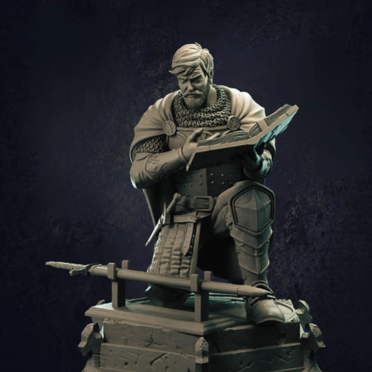 A male human paladin depicted in an oath pose, kneeling atop a detailed pedestal with one hand raised and the other holding an open book. Dressed in intricate armor featuring chainmail and a flowing cape, the figure has a sword sheathed at the waist and a shield on the back.