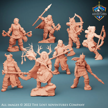 A collection of eight unpainted 3D-printed female Snow Orc miniatures posed against a dark background. The figures include fierce barbarians wielding axes and clubs, agile rangers with drawn bows, and mystical druids adorned with antlers and nature-inspired attire. Each miniature is highly detailed, showcasing unique armor, weapons, and dynamic stances—perfect for tabletop RPG adventures. Designed by Lost Adventures at a 32mm Scale.