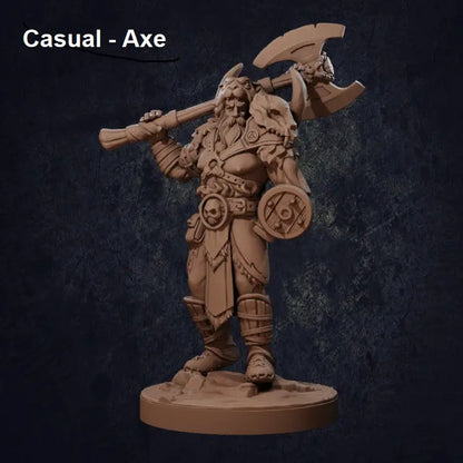 A highly detailed DnD miniature of a Viking-style barbarian warrior standing in a relaxed but imposing stance, holding a battle axe casually at his side. The warrior has a muscular build, long flowing hair, and a stoic expression. He wears rugged armor with fur accents, including a chest harness, bracers, and greaves. The base is textured to resemble rocky terrain, adding depth to the figure’s presence.