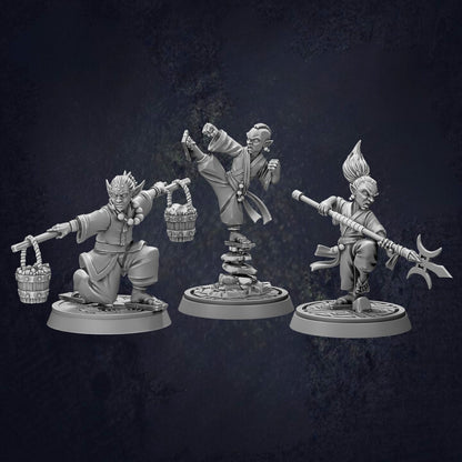 three action figures, each with unique poses and weapons, set against a dark background.