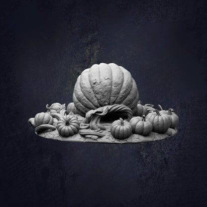 A large, intricately carved pumpkin sits atop a pile of smaller pumpkins, creating a visually striking and artistic composition.