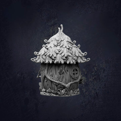 A whimsical, tree-like structure with a pointed roof and intricate details, resembling a fairy house or a small treehouse.