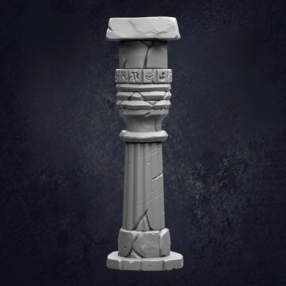 A white stone column with a carved design on the top, set against a dark background.