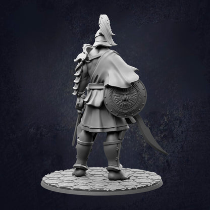 A statue of a warrior standing in a defensive stance, holding a shield and sword, with a tall helmet on his head.