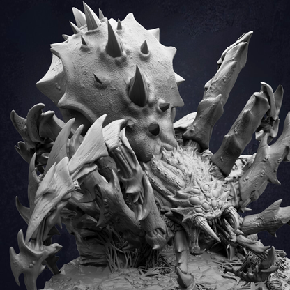 A detailed, intricate sculpture depicting a large, menacing creature with sharp teeth and spikes, surrounded by smaller, equally menacing creatures.